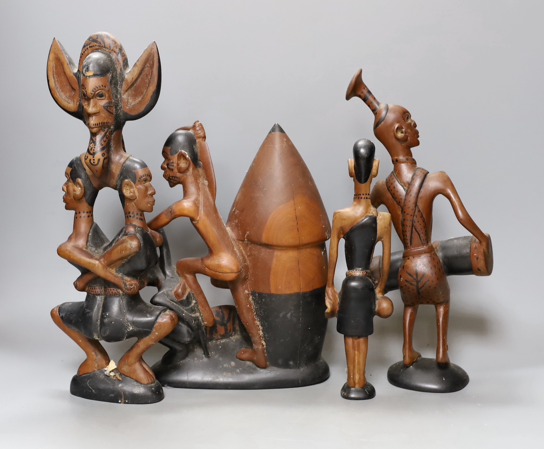 A narrative set of African wooden carvings, 35cm
